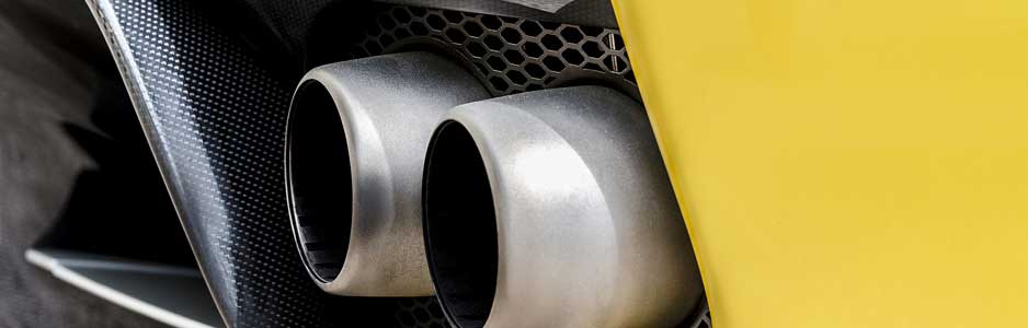 A close up photograph of a car exhaust on a high performance car