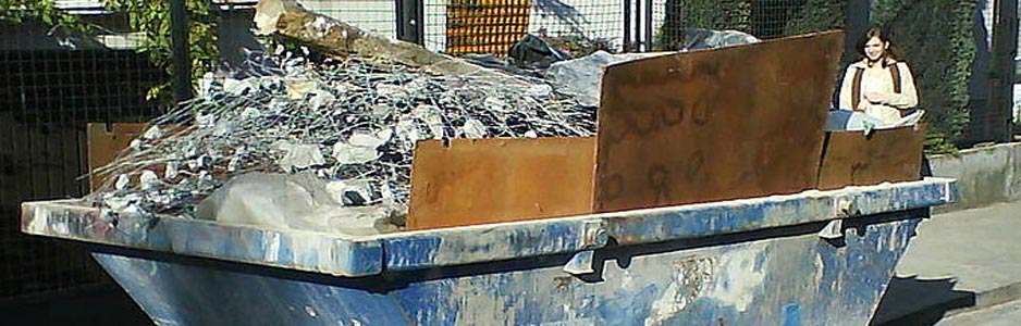 An example of a hired skip filled with waste building materials