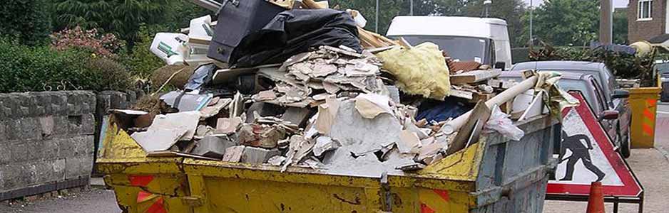 An example of a hired skip filled with rubbish outside on a street