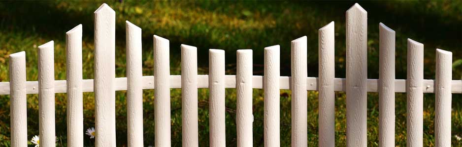 An example of a white picket garden fence